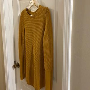 Like new cotton/poly gold sweater with great accents, launders well, worn twice